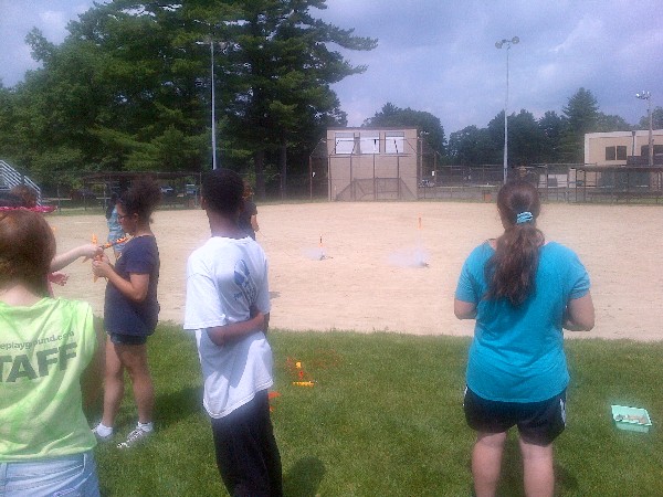 Students prepare to launch rockets during Rocket Day in June.